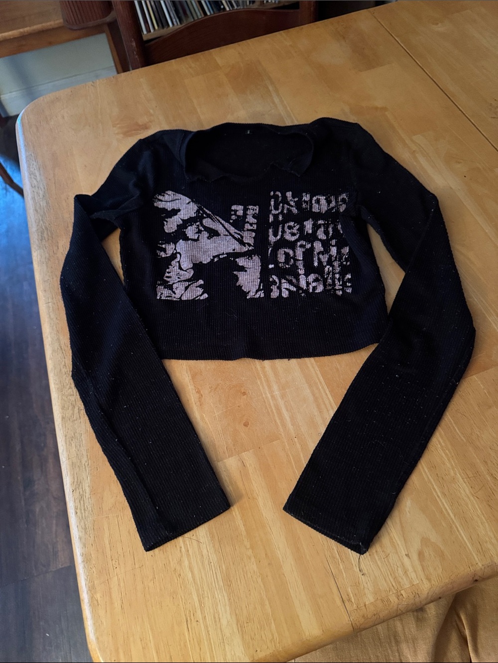Black Cropped Knit Long-Sleeve Top with Graphic Detail